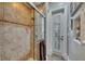Updated shower with tile surround, glass door, and modern fixtures at 624 Balibay Rd, Apollo Beach, FL 33572