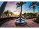 Beautiful water fountain with palm trees, waterfront and sunset view at 624 Balibay Rd, Apollo Beach, FL 33572