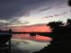 Beautiful sunset view from the property's waterfront location, showcasing peaceful water reflections at 624 Balibay Rd, Apollo Beach, FL 33572