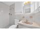 Well-lit bathroom features tiled walls, updated fixtures, and clean finishes at 6638 12Th N Ter, St Petersburg, FL 33710