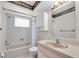 Clean and simple bathroom featuring tile walls, a bath/shower, and vanity at 6638 12Th N Ter, St Petersburg, FL 33710
