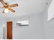 This bright bedroom features wood paneling, neutral walls, and ample natural light at 6638 12Th N Ter, St Petersburg, FL 33710