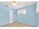 Bright bedroom featuring a ceiling fan and natural light from the window at 6638 12Th N Ter, St Petersburg, FL 33710