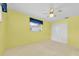 Bedroom with built-in wardrobe, ceiling fan and natural light from the window at 6638 12Th N Ter, St Petersburg, FL 33710