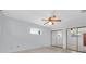 This bedroom features wood paneling, neutral walls, carpet, ample natural light, and mirrored closet doors at 6638 12Th N Ter, St Petersburg, FL 33710