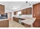 Practical kitchen featuring a breakfast bar, lots of cabinets, and bright lighting at 6638 12Th N Ter, St Petersburg, FL 33710