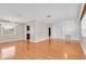 Open-concept living and dining area with hardwood floors, chandelier, and lots of natural light at 6638 12Th N Ter, St Petersburg, FL 33710