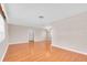 Open living space featuring gleaming hardwood floors and neutral paint scheme at 6638 12Th N Ter, St Petersburg, FL 33710