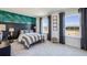 Bright bedroom featuring neutral tones, ocean themed decor, and lots of natural light at 6745 Flint Creek Dr, Land O Lakes, FL 34638
