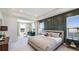 Spacious main bedroom featuring neutral tones, lots of natural light and views of the water at 6745 Flint Creek Dr, Land O Lakes, FL 34638