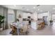 Eat-in kitchen with stainless steel appliances, island, granite counters and white cabinets at 6779 Flint Creek Dr, Land O Lakes, FL 34638