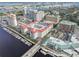 Breathtaking aerial view of a waterfront community with lush greenery, a boat marina, and a central pool at 700 S Harbour Island Blvd # 105, Tampa, FL 33602