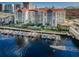 Beautiful aerial view of waterfront condos with boat docks, pool, and lush landscaping at 700 S Harbour Island Blvd # 105, Tampa, FL 33602
