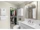 Updated bathroom with tile backsplash, framed mirror, and a closet with ample storage space at 700 S Harbour Island Blvd # 105, Tampa, FL 33602