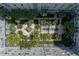 An aerial view of a courtyard with lush greenery, a fountain, and shaded seating areas at 700 S Harbour Island Blvd # 105, Tampa, FL 33602