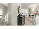 Bright hallway area featuring a dark wood dresser and stylish decor leading to a bedroom with mirrored closet at 700 S Harbour Island Blvd # 105, Tampa, FL 33602
