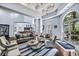 Comfortable living room featuring a seating area, bar, and large windows at 700 S Harbour Island Blvd # 105, Tampa, FL 33602