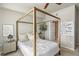 Comfortable main bedroom with a canopy bed, accent lighting, and tasteful decor, providing a relaxing atmosphere at 700 S Harbour Island Blvd # 105, Tampa, FL 33602