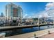 Picturesque marina with boats docked, set against a backdrop of a modern building and a clear blue sky at 700 S Harbour Island Blvd # 105, Tampa, FL 33602
