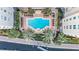 An aerial view of a pool surrounded by lounge chairs and palm trees at 700 S Harbour Island Blvd # 105, Tampa, FL 33602