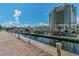 Waterfront view showcasing boats docked at the marina near a luxury hotel, under a sunny, partly cloudy sky at 700 S Harbour Island Blvd # 105, Tampa, FL 33602