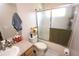 This bathroom showcases a glass-door shower, toilet and vanity with decor at 7334 Night Heron Dr, Land O Lakes, FL 34637