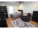 Well-decorated bedroom featuring a comfortable bed, accent chair, and ample storage at 7334 Night Heron Dr, Land O Lakes, FL 34637