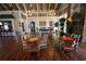View of the community center's relaxing lounge area with wood floors, fireplace, and decorative lighting at 7334 Night Heron Dr, Land O Lakes, FL 34637