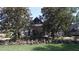 Community clubhouse featuring lush landscaping and an inviting covered entryway at 7334 Night Heron Dr, Land O Lakes, FL 34637