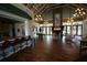 Large community center area with beautiful wood floors, exposed beam ceiling and cozy fireplace at 7334 Night Heron Dr, Land O Lakes, FL 34637