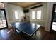 Community game room with ping pong table, jukebox and hard wood floors at 7334 Night Heron Dr, Land O Lakes, FL 34637