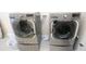 Stainless-steel LG front-loading washer and dryer in the laundry room at 7334 Night Heron Dr, Land O Lakes, FL 34637