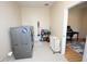 Well organized laundry room with modern washer and dryer with built in storage at 7334 Night Heron Dr, Land O Lakes, FL 34637