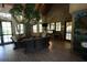 Community center lounge area with cozy seating, decorative tree, and natural light at 7334 Night Heron Dr, Land O Lakes, FL 34637