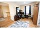 Comfortable office with wood floors, rolling desk chair, and good light at 7334 Night Heron Dr, Land O Lakes, FL 34637