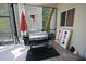 Outdoor patio features a stainless steel grill, patio heater, and cornhole game, perfect for entertaining at 7334 Night Heron Dr, Land O Lakes, FL 34637