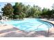 Community swimming pool with lifeguard equipment and lounge chairs around the pool at 7334 Night Heron Dr, Land O Lakes, FL 34637