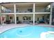 Enjoy the sparkling pool and covered patio in this home's backyard at 7334 Night Heron Dr, Land O Lakes, FL 34637