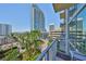 Balcony featuring city views, lush greenery, and stylish outdoor seating at 777 N Ashley Dr # 1011, Tampa, FL 33602