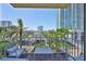 Condo balcony with seating overlooking the city skyline and lush greenery at 777 N Ashley Dr # 1011, Tampa, FL 33602