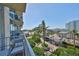 Enjoy city views from this condo balcony with comfortable seating at 777 N Ashley Dr # 1011, Tampa, FL 33602
