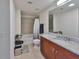 Clean bathroom features granite countertop vanity, a bathtub, and neutral tile flooring at 777 N Ashley Dr # 1011, Tampa, FL 33602