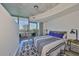 Bright bedroom features a balcony with city views and stylish modern décor at 777 N Ashley Dr # 1011, Tampa, FL 33602