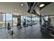Bright community gym featuring workout equipment and expansive windows providing natural light and city views at 777 N Ashley Dr # 1011, Tampa, FL 33602