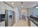 Modern kitchen with stainless steel appliances, stylish tile backsplash, and white cabinetry at 777 N Ashley Dr # 1011, Tampa, FL 33602