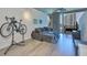 Modern living room with stylish gray sectional, concrete ceilings, and city views from the large windows at 777 N Ashley Dr # 1011, Tampa, FL 33602