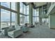 Grand lounge area with comfortable seating, floor to ceiling windows, and views of the city skyline at 777 N Ashley Dr # 1011, Tampa, FL 33602