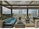 Relaxing patio area featuring comfortable lounge seating, a modern ceiling fan, and city views at 777 N Ashley Dr # 1011, Tampa, FL 33602