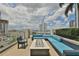 Community patio with a modern fire pit, comfortable seating, and city views at 777 N Ashley Dr # 1011, Tampa, FL 33602