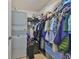 Walk-in closet with stackable washer and dryer and ample hanging space at 777 N Ashley Dr # 1011, Tampa, FL 33602